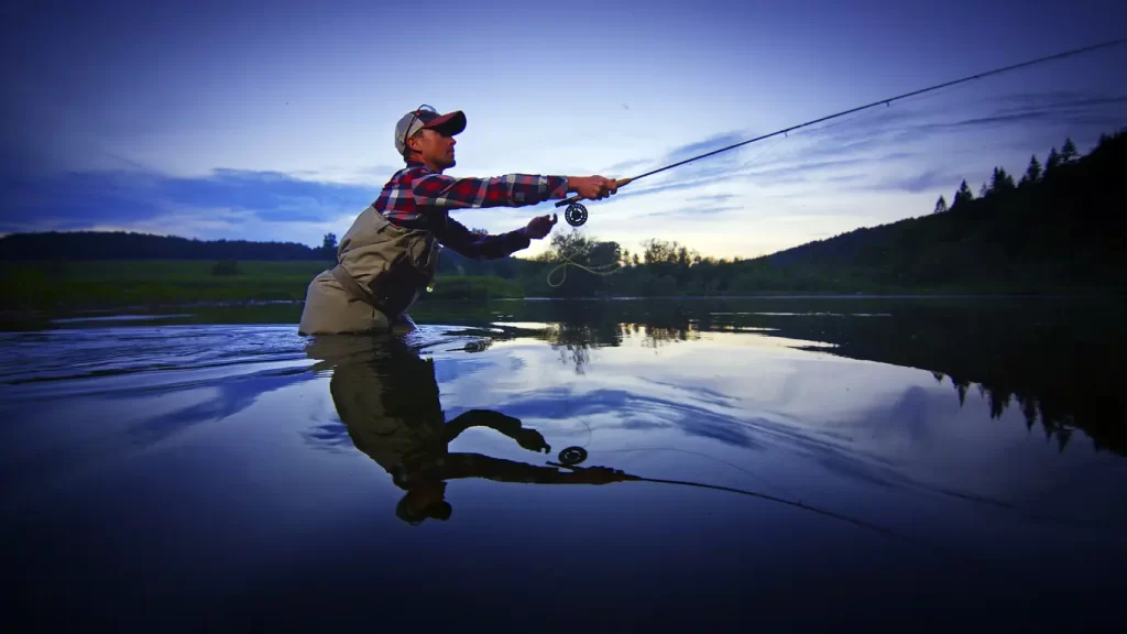 A man fly-fishing tries anther cast for the fish of his dreams.